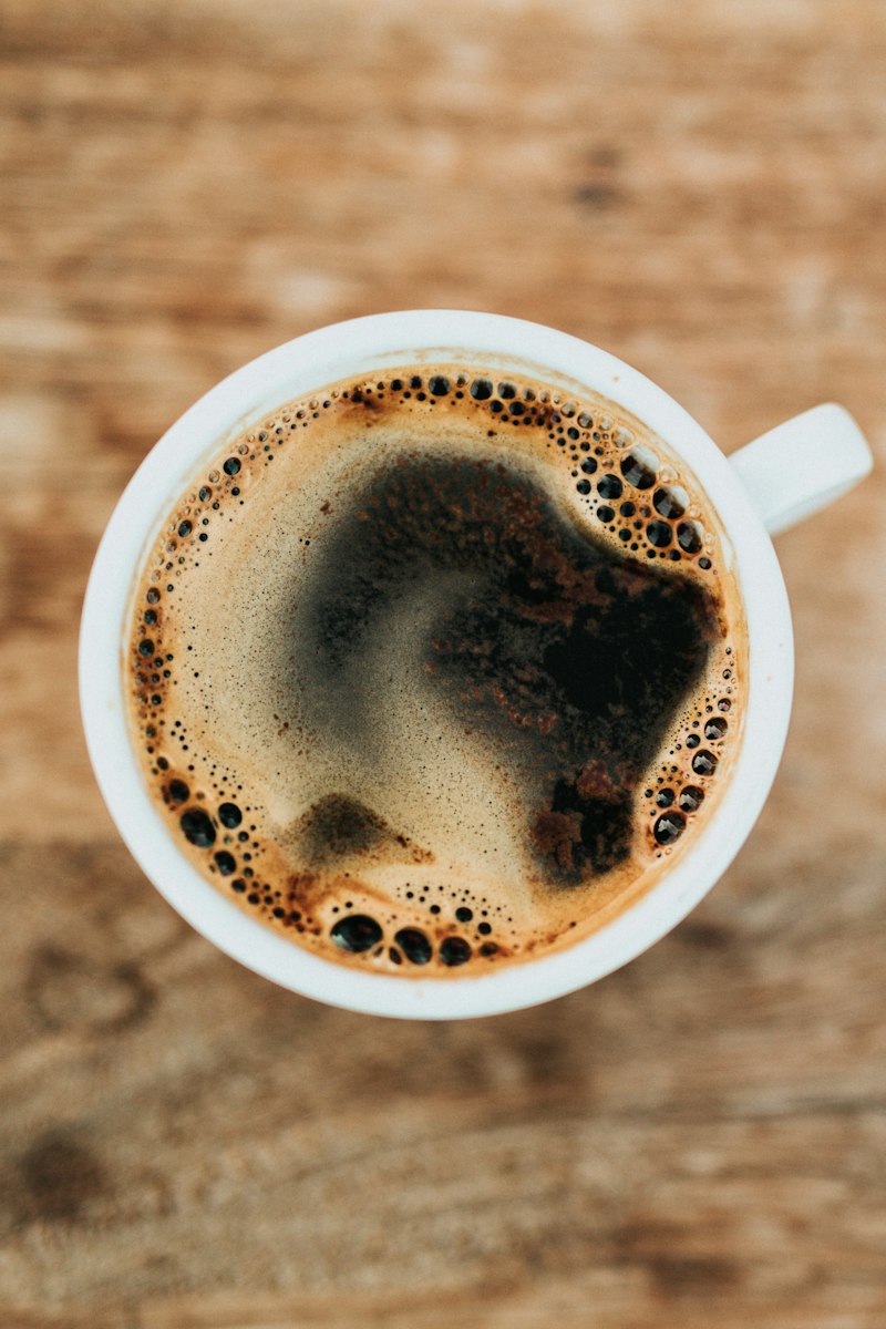 A cup of black coffee seen from above